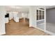 Open concept living space with wood floors, an island kitchen, and sliding doors at 19584 Atwater Ave, Sheridan, IN 46069