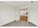 Home office with carpet and French doors leading to a modern kitchen area at 19584 Atwater Ave, Sheridan, IN 46069