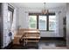 Cozy breakfast nook with wooden seating and table, large windows, and lots of natural light at 2215 S Delaware St, Indianapolis, IN 46225