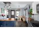 Eat-in kitchen features an island with seating, hardwood floors, and updated appliances at 2215 S Delaware St, Indianapolis, IN 46225