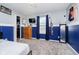 A tidy bedroom with a two-tone paint scheme, closet, dresser, and view of the backyard at 2258 Bridlewood Dr, Franklin, IN 46131