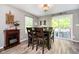 The dining area has a modern chandelier and opens to a patio through sliding glass doors with backyard views at 2258 Bridlewood Dr, Franklin, IN 46131