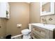 Neat half-bath with modern vanity, contemporary fixtures, and tile accents at 2258 Bridlewood Dr, Franklin, IN 46131