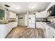 Bright kitchen featuring white cabinetry, modern appliances, and dark countertops at 2258 Bridlewood Dr, Franklin, IN 46131