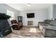 Comfortable living room featuring a plush sofa and a wall-mounted TV at 2258 Bridlewood Dr, Franklin, IN 46131