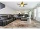 Spacious living room with wood-look flooring and a comfortable sectional, perfect for relaxing and entertaining at 2258 Bridlewood Dr, Franklin, IN 46131