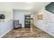 Well-lit living space with decorative wall accents and a view into the kitchen at 2258 Bridlewood Dr, Franklin, IN 46131