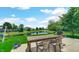 Inviting backyard featuring a patio with seating and scenic pond views and fence at 237 Broadmoor Bnd, Pittsboro, IN 46167