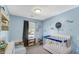 Charming bedroom features a crib, a small bed with blue accents, and nautical decorations at 237 Broadmoor Bnd, Pittsboro, IN 46167