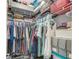 Walk-in closet features ample storage, including rods, shelves, and built-in organizers at 237 Broadmoor Bnd, Pittsboro, IN 46167