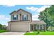 Two-story home with vinyl siding, brick accents, and attached two-car garage on a sunny day at 237 Broadmoor Bnd, Pittsboro, IN 46167