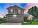 Beautiful two-story home features a two-car garage, a landscaped yard and colorful sunset at 237 Broadmoor Bnd, Pittsboro, IN 46167