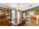 Charming eat-in kitchen with wood cabinets, stainless steel appliances, and hardwood floors at 237 Broadmoor Bnd, Pittsboro, IN 46167