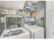 Laundry area features a side-by-side washer and dryer and shelving for storage at 237 Broadmoor Bnd, Pittsboro, IN 46167