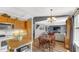 Open-concept living space with wood floors seamlessly connecting kitchen, dining, and living areas at 237 Broadmoor Bnd, Pittsboro, IN 46167