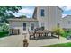Backyard view of outdoor dining area with a grill, and a concrete patio for entertainment and leisure at 237 Broadmoor Bnd, Pittsboro, IN 46167