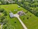 Large estate featuring a beautiful home, spacious lawn, pool, playground, and other outbuildings at 2825 S State Road 267, Plainfield, IN 46168