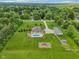 Expansive property featuring a pool, lush lawn, mature trees, and outbuildings at 2825 S State Road 267, Plainfield, IN 46168