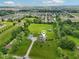 Expansive aerial view of the home with a pool, large green lawn, and surrounding neighborhood at 2825 S State Road 267, Plainfield, IN 46168