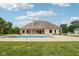 Expansive backyard showcasing the pool area, home exterior, and beautifully landscaped grounds at 2825 S State Road 267, Plainfield, IN 46168