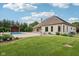 Lush backyard featuring a sparkling pool, perfect for relaxation and outdoor gatherings at 2825 S State Road 267, Plainfield, IN 46168