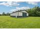 Spacious barn on a well-maintained grassy lawn, perfect for storage or hobbies in a rural setting at 2825 S State Road 267, Plainfield, IN 46168