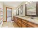 Bathroom featuring double vanity, granite countertops, wood cabinetry, and tile floors at 2825 S State Road 267, Plainfield, IN 46168