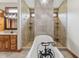 Bright bathroom featuring a soaking tub, tiled shower and a chandelier at 2825 S State Road 267, Plainfield, IN 46168