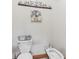 A neutral bathroom is decorated with brown decor with a bidet and a toilet at 2825 S State Road 267, Plainfield, IN 46168