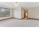 Bright bedroom showcasing a ceiling fan, window, and an ensuite closet at 2825 S State Road 267, Plainfield, IN 46168