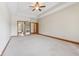 Large primary bedroom with ensuite bathroom and neutral carpet at 2825 S State Road 267, Plainfield, IN 46168