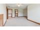 Carpeted bedroom featuring neutral colors, trim, ceiling fan, and walk-in closet at 2825 S State Road 267, Plainfield, IN 46168