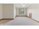 Bright bedroom with neutral carpet, trim, ceiling fan, and a large window at 2825 S State Road 267, Plainfield, IN 46168