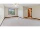 Spacious bedroom featuring carpet, a ceiling fan, and natural light from the window at 2825 S State Road 267, Plainfield, IN 46168
