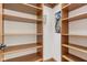 Walk-in closet with custom wood shelving at 2825 S State Road 267, Plainfield, IN 46168