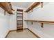 Walk-in closet featuring custom wood shelving and neutral carpet at 2825 S State Road 267, Plainfield, IN 46168