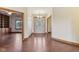 Inviting foyer with hardwood floors and decorative glass front door creates a warm welcome at 2825 S State Road 267, Plainfield, IN 46168