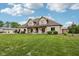 Charming home with a well-manicured lawn and a welcoming front porch at 2825 S State Road 267, Plainfield, IN 46168