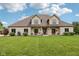 Charming home with a well-manicured lawn and a welcoming front porch at 2825 S State Road 267, Plainfield, IN 46168