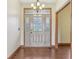Elegant foyer with decorative glass door and hardwood floors at 2825 S State Road 267, Plainfield, IN 46168