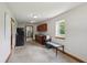Kitchen featuring wooden cabinetry, small window, and concrete flooring at 2825 S State Road 267, Plainfield, IN 46168