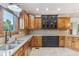 Kitchen features granite countertops, wood cabinets, and a stainless steel sink at 2825 S State Road 267, Plainfield, IN 46168