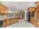 Spacious kitchen with granite counters, wood cabinets and stainless steel refrigerator at 2825 S State Road 267, Plainfield, IN 46168