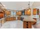 Spacious kitchen with granite countertops, stainless steel appliances, and wood cabinetry at 2825 S State Road 267, Plainfield, IN 46168