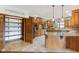 Farmhouse kitchen featuring custom cabinets, granite countertops, island, and tile flooring at 2825 S State Road 267, Plainfield, IN 46168
