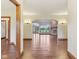Spacious living area boasts an open layout, wood floors, and a cozy fireplace at 2825 S State Road 267, Plainfield, IN 46168
