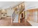 Spacious living room featuring staircase to upper level, hardwood floors, and fireplace at 2825 S State Road 267, Plainfield, IN 46168