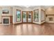 Inviting living space with fireplace and views of the pool from large glass doors at 2825 S State Road 267, Plainfield, IN 46168