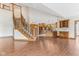 Spacious living room featuring staircase to upper level, hardwood floors, and open kitchen at 2825 S State Road 267, Plainfield, IN 46168