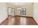 Bright living room showcasing hardwood floors and chandelier at 2825 S State Road 267, Plainfield, IN 46168